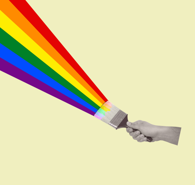 Hand dat verfbostel vastheeft waarmee die regenboog schildert
